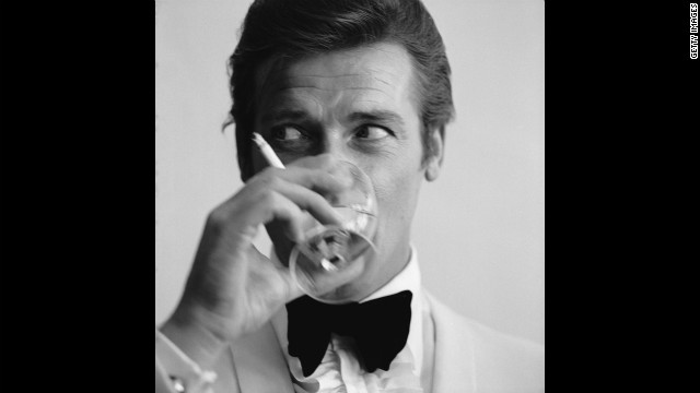 Roger Moore drinks a martini, James Bond's signature drink.