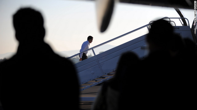 Romney boards his campaign plane on Friday.