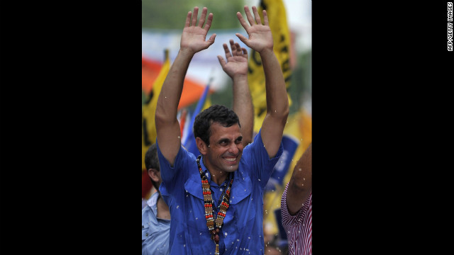 Capriles greets supporters during a Thursday's campaign rally in San Carlos.