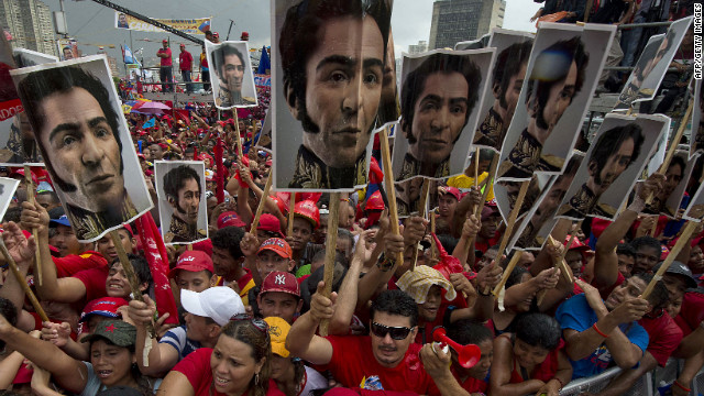 Supporters of Venezuelan President Hugo Chavez hold photos of Simon Bolivar, who led Venezuela's fight for independence from Spain in the 1820s, during his campaign wrapup rally in Caracas on Thursday, October 4. The leftist leader, in power for almost 14 years, is vying for a fourth term in office that would extend his presidency for another six years.