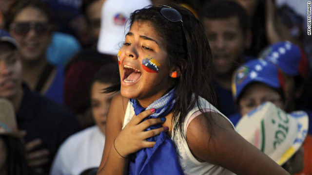 A supporter of the opposition candidate, Capriles, screams during a campaign rally in Maracaibo.