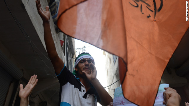 A Syrian demonstrator shouts during an anti-regime protest in Aleppo on Friday, October 5. Tensions rippled across Turkey a day after Syrian shells struck a Turkish border town and killed five people. <a href='www.cnn.com/SPECIALS/world/photography/index.html' target='_blank'>See more of CNN's best photography.</a>