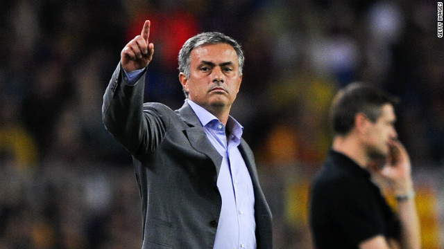 Jose Mourinho gestures during the El Clasico clash with his Barcelona counterpart Tito Vilanova in the background. 