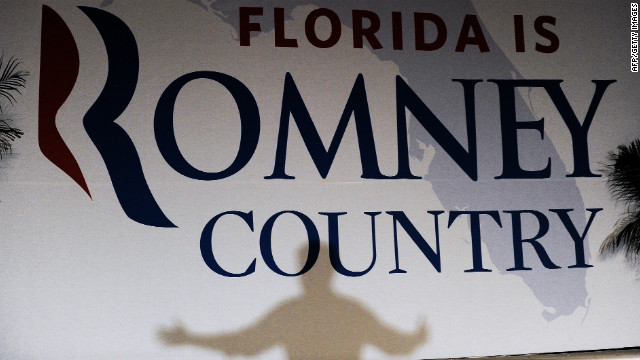 Romney casts a shadow on a banner as he speaks during a campaign event in Apopka, Florida, on Saturday, October 6.