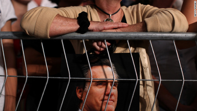 A supporter holds a photograph of Romney in Apopka on Saturday.