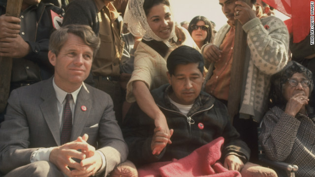 Robert F. Kennedy sits next to Chavez, very weak after a prolonged hunger strike, in March 1968 during a rally in support of the United Farm Workers in Delano, California.