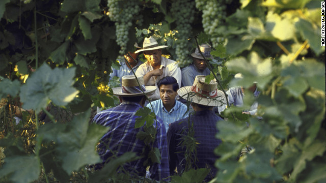 On behalf of his group, Chavez talks with grape pickers during a national boycott of California grapes in 1965.