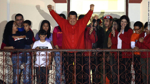 Venezuelan President Hugo Chavez greets supporters after receiving news of his re-election in Caracas on Sunday, October 7. With 90% of the ballots counted, Chavez, who has been president since 1999, defeated Henrique Capriles Radonski with 54.42% of the votes, according to an National Electoral Council official. Photos: Venezuela's presidential vote