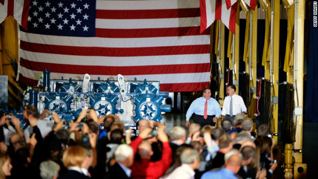 New Jersey Gov. Chris Christie, left, and Republican presidential nominee Mitt Romney walk up to the stage at Ariel Corporation in Mount Vernon, Ohio, on Wednesday.