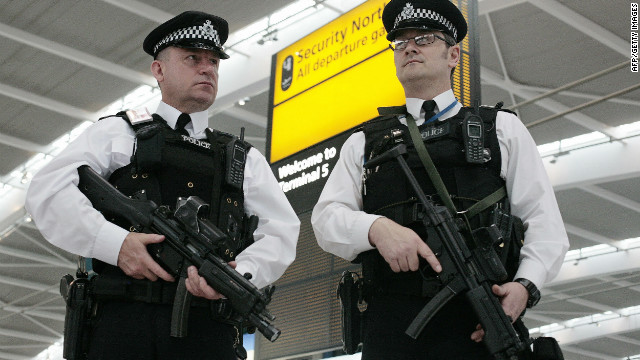 British police arrested a man and a woman at London's Heathrow Airport as part of an investigation into travel to Syria for alleged terror activity.