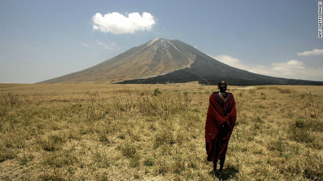 A Masai tribesman stands on the slopes leading up to the Ol Doinyo Lengai volcano in the Ngorongoro Conservation Area, one of seven UNESCO World Heritage Sites in Tanzania.