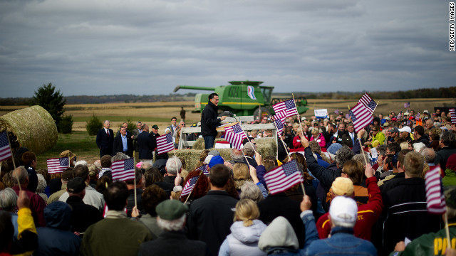 Supporters cheer as Romney delivers remarks on the James Koch Farm in Van Meter, Iowa, on Tuesday.