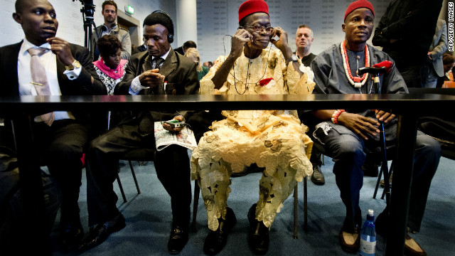 Four Nigerian farmers sit in the law courts in The Hague on Thursday.