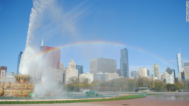 A rainbow frames the Chicago skyline with the Buckingham Fountain in Grant Park, downtown.
