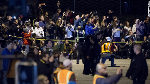 Spectators take pictures of the shuttle Friday at the Los Angeles airport. Once it reaches the science museum, the shuttle will be on display for posterity. It had its first launch in 1992.