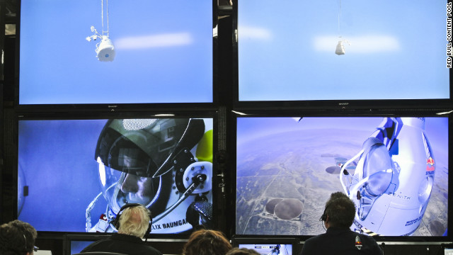 People at the mission control center in Roswell, New Mexico, watch Baumgartner during his ascent on Sunday.