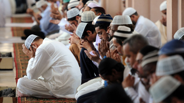 Pakistani Muslims bow their heads and pray for Malala during Friday prayers in Karachi.