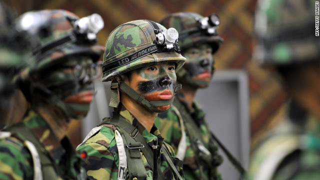 South Korean soldiers stand guard during a joint US-South Korean military exercise in Seoul on August 21, 2012.