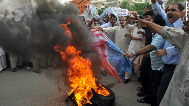 Pakistanis burn a U.S. flag during a protest against an anti-Islam movie in Islamabad on September 15. Columnist Masud Alam says relations between the two countries are at an all-time low.