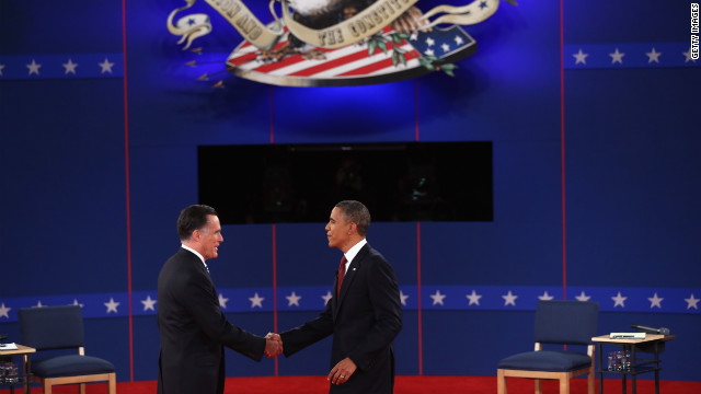 Republican presidential candidate Mitt Romney and U.S. President Barack Obama greet each other on stage.