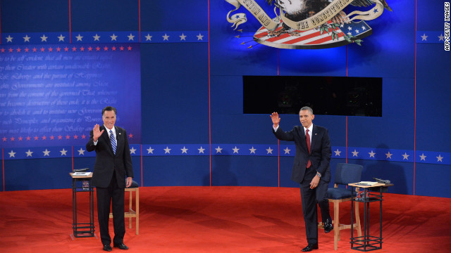 U.S. President Barack Obama and Republican presidential nominee Mitt Romney greet the audience.