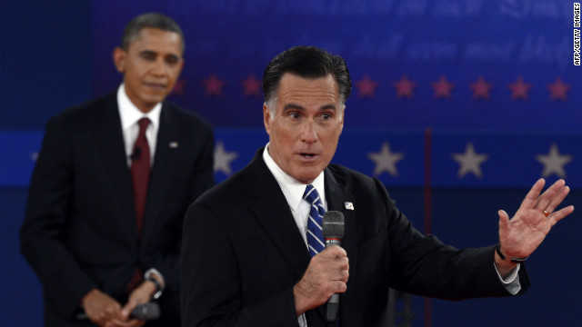 U.S. President Barack Obama listens to Republican presidential candidate Mitt Romney.