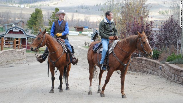 Richard Quest with rancher Connie Dorsey on horseback in Grandby, Colorado.
