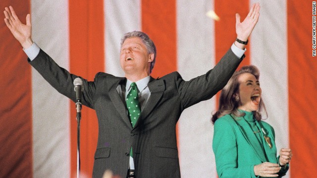 With Hillary, Democratic presidential candidate Bill Clinton waves to the crowd during his victory party after winning the Illinois primary on March 17, 1992.