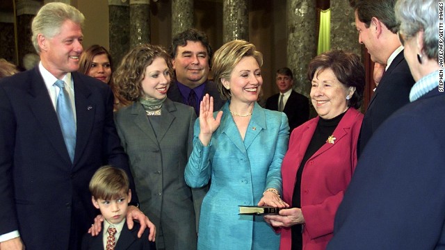 First lady Hillary Clinton is sworn in as a senator in a re-enactment ceremony with U,S. President Bill Clinton, from left, nephew Tyler, daughter Chelsea, brother Hugh Rodham, mother Dorothy Rodham and Vice President Al Gore in the Old Senate Chamber on Capitol Hill on January 3, 2001, in Washington.