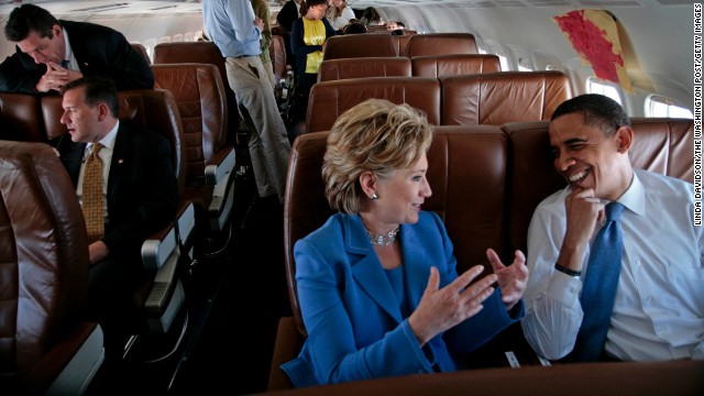 Barack Obama and Clinton talk on the plane on their way to a Unity Rally in Unity, New Hampshire, on June 27, 2008.