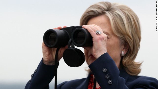 Clinton looks through binoculars toward North Korea during a visit to observation post Ouellette at the Demilitarized Zone separating the two Koreas in Panmunjom on July 21, 2010.