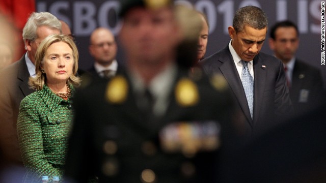 U.S. President Barack Obama and Clinton observe a moment of silence before a NATO meeting on November 19, 2010, in Lisbon, Portugal.