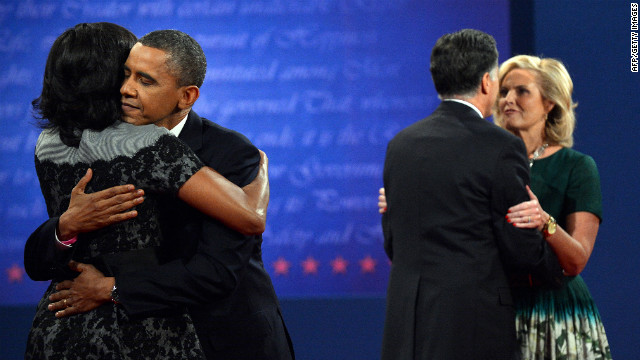 President Barack Obama and Republican presidential candidate Mitt Romney hug their wives on stage after finishing their third and final presidential debate at Lynn University in Boca Raton, Florida, on Monday, October 22. 