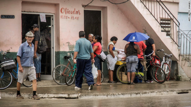 Citizens of Bayamo, Cuba, buy food on Wednesday, as they prepare for the arrival of Hurricane Sandy.