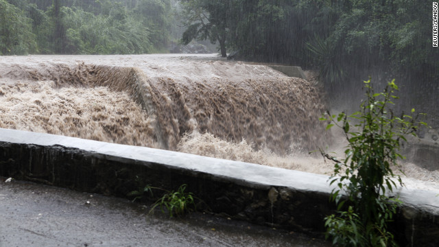 The Hope River begins to swell with rain from approaching Hurricane Sandy in Kingston on Wednesday.