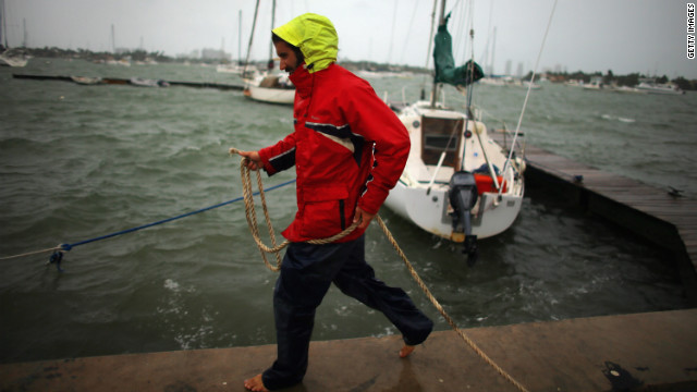Corey Hutterli works on securing his sailboat as the outer bands of Hurricane Sandy are felt in Miami Beach, Florida, on Thursday, October 25.