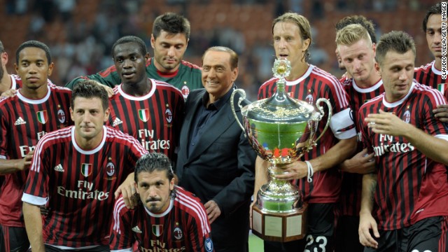 AC Milan players and AC Milan chairman Berlusconi celebrate after winning the Luigi Berlusconi Trophy at Giuseppe Meazza Stadium on August 21, 2011, in Milan, Italy.