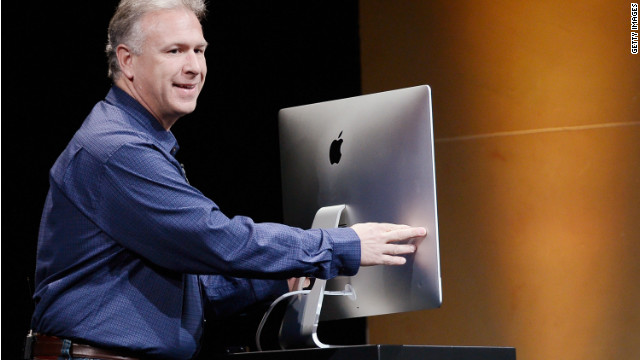 Apple marketing chief Phil Schiller shows off an ultra-thin new iMac at Apple's launch event last Tuesday.