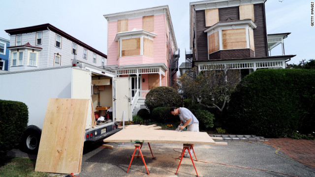 Burt Myrich boards up a home in preparation for Hurricane Sandy on Saturday in Cape May, New Jersey. 