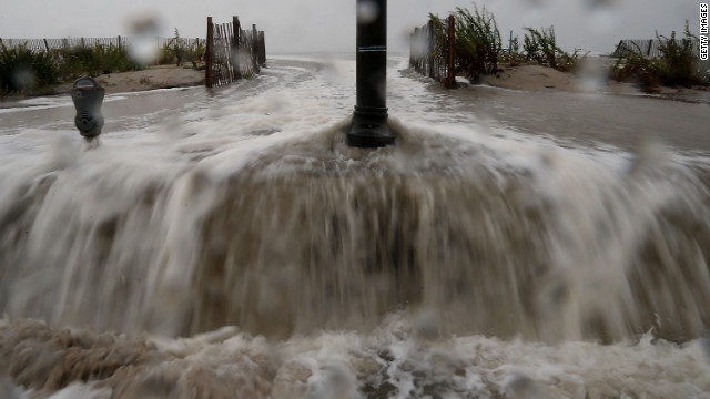 Water forced ashore ahead of the hurricane starts to flood Beach Avenue in Cape May on Monday morning.