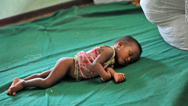 A baby sleeps at a refugee camp in Mrauk U in Myanmar on Sunday. The U.N. is already assisting 75,000 people forced to flee earlier this year when violence first erupted in western Myanmar.