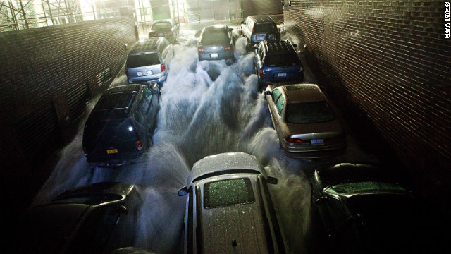 Rising water rushes into an underground parking garage in New York's financial district on Monday, October 29. 