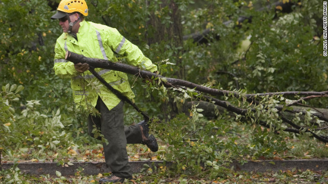 Downed trees are removed near the Korean War Veterans Memorial in Washington on Tuesday.