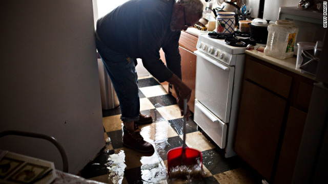 Jolito Ortiz helps clean up a friend's apartment on New York's lower east side on Tuesday.