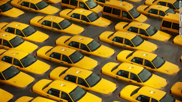 Taxis sit in a flooded lot Tuesday in Hoboken, New Jersey.
