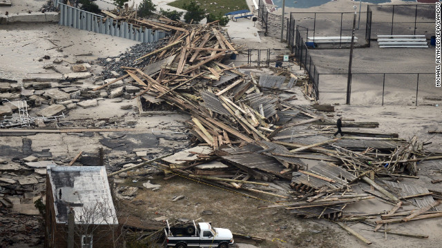 Debris from damaged property and the remains of a boardwalk litter the shoreline in Atlantic City on Wednesday.
