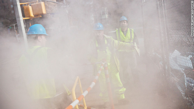 Con Edison crew members work on a steam pipe on First Avenue on Wednesday.