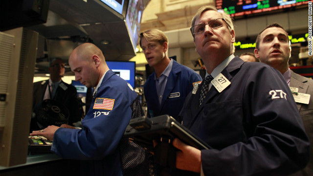Traders work on the floor of the New York Stock Exchange on Wednesday after it had been closed for two days.