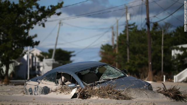 Superstorm Sandy left a car buried in sand in Long Beach Island, New Jersey.