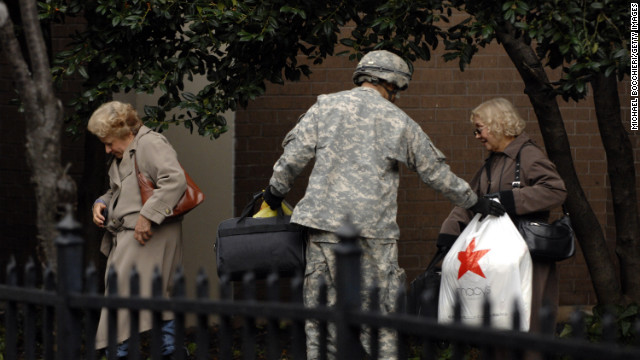 A member of Army National Guard Unit Gulf 250 from Morristown, New Jersey, evacuates victims of Hurricane Sandy in Hoboken on Wednesday, October 31.